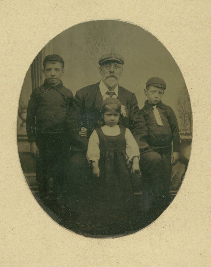 Granddad Stevenson with John, Allan and Lizzie